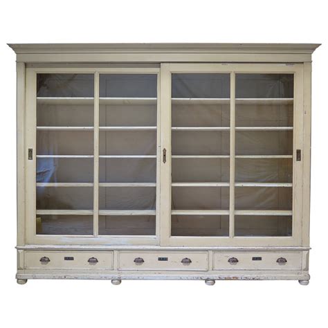 Customs services and international tracking provided. Elegant Bookcase with Sliding Glass Doors, France, Early ...
