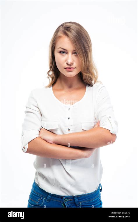Portrait Of A Pretty Young Woman Standing With Arms Folded Isolated On