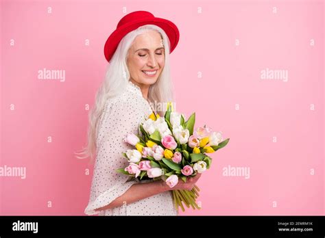 Profile Side View Portrait Of Charming Cheerful Grey Haired Granny Holding Floral Bunch Romantic