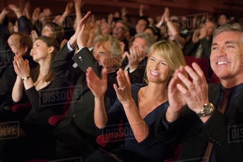 Enthusiastic audience clapping in theater - Stock Photo ...