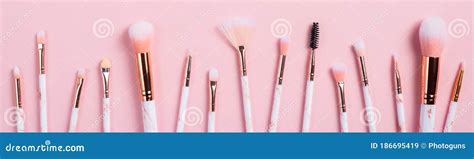 Set Of Makeup Brushes In Row On Pink Background Professional Cosmetics