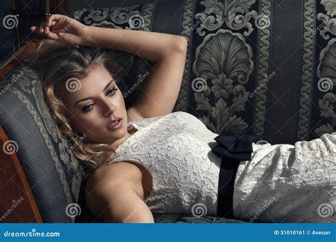 Beautiful Woman Seated On A Sofa Stock Image Image Of Glamour Person