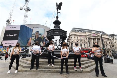 six pregnant women bare their bumps at piccadilly circus demanding an end to fossil fuels