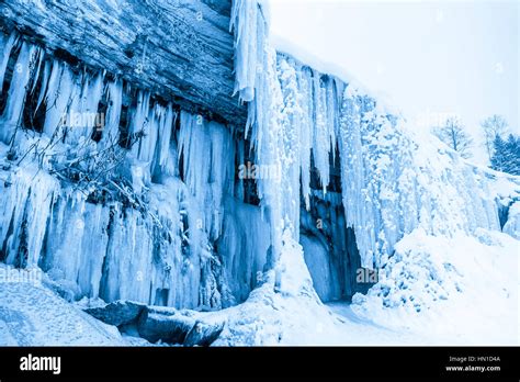 Ice Cave In Frozen Waterfall Jagala Estonia Stock Photo Alamy