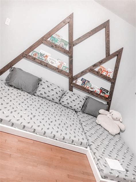 I made this stylish playhouse style floor bed for a toddler to keep their noggins safe should they roll off the bed in the middle of the night. Montessori Inspired Mountain Range Bed from 2x4s | Kids floor bed, Boy room bedding, Toddler ...