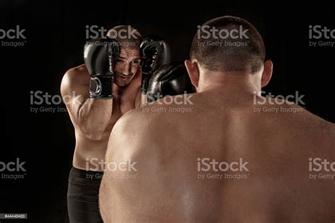 Two Muscular Men Fighting Bodybuilders Punching Each Other Training In