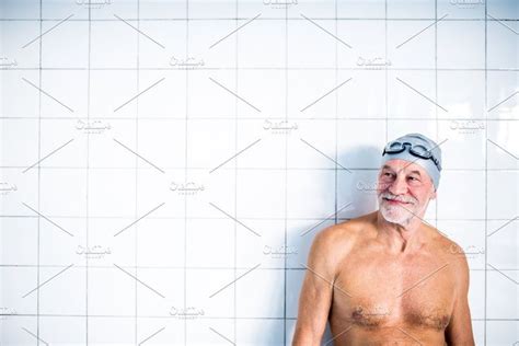 Portrait Of A Senior Man In An Indoor Swimming Pool By HalfPoint On