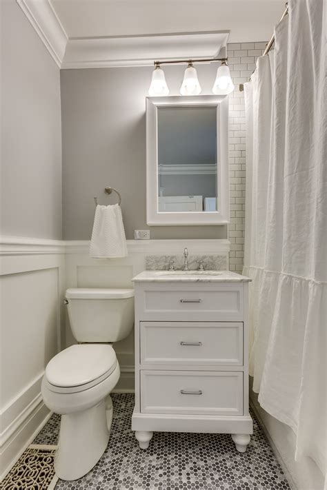 Victorian Renovation Bathroom With Gray Walls And White Wainscoting In