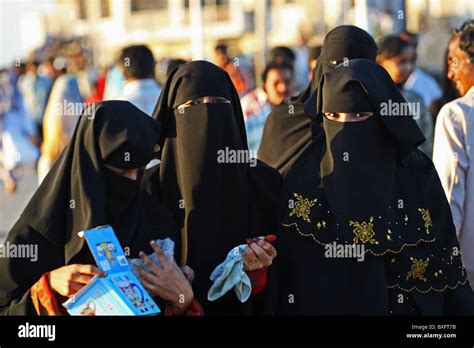 Group Of Muslim Women In Hijab Opening Present Stock Photo