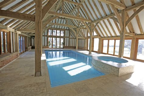 This indoor swimming pool is right next to the dining room which makes the ambiance feels cozier. Indoor Swimming Pool Ideas - HomesFeed