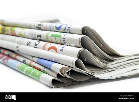 Newspapers Folded And Stacked Isolated On White Stock Photo Alamy