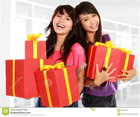 Two Young Girls Carrying Present Stock Image Image Of Asian Present