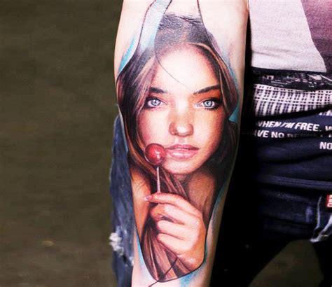Portrait Style Colored Forearm Tattoo Of Girl With Lollypop