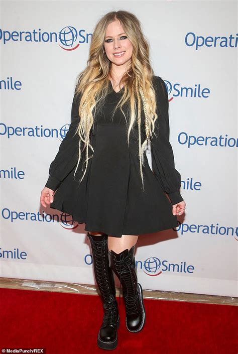 Avril Lavigne Is Punk Chic In Black Mini Dress With Leather Thigh High