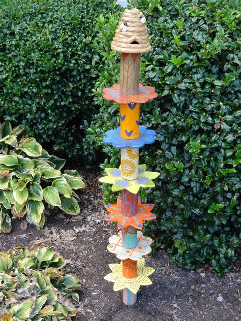 Brighten Your Home Garden With A Garden Totem With A Beehive On Top