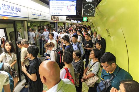 Commuters Waiting For A Train In The Mtr Wan Chai In Hong Kong