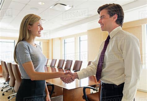 Business Man And Woman Shaking Hands Stock Photo Dissolve