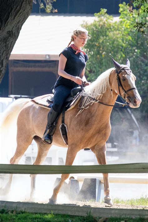 Amber Heard Brings Her Father David Heard With Her As She Goes