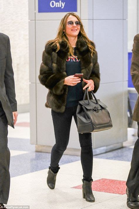 Liz Hurley Looks Chic In A Fur Coat As She Touches Down In New York