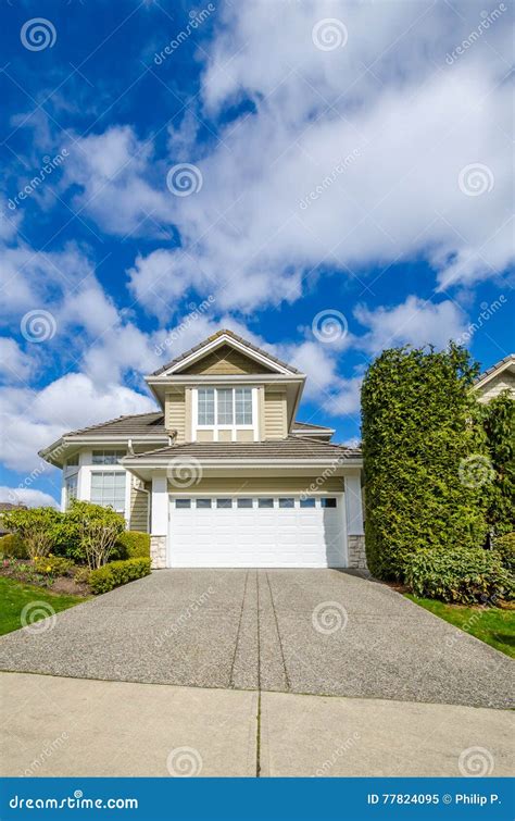 Luxury House With Beautiful Landscaping On A Sunny Day Stock Image