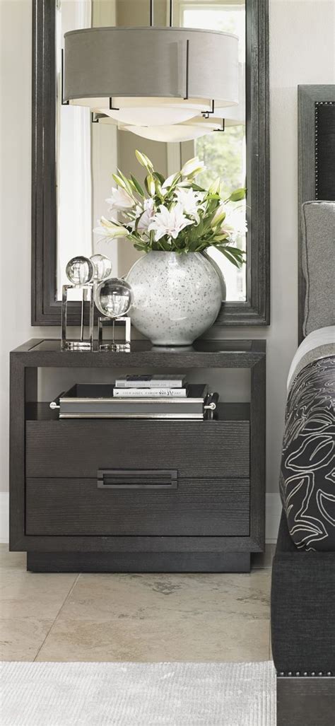 A bedside table is not only a decorative piece of furniture but also one that is functional. Grey nightstand. Bedroom decor ideas. Luxury furniture ...