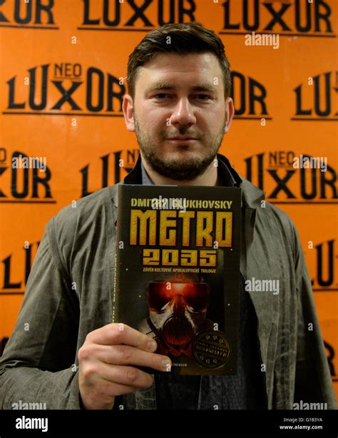 Russian Writer Dmitry Glukhovsky Holds His Book During The Fair Book