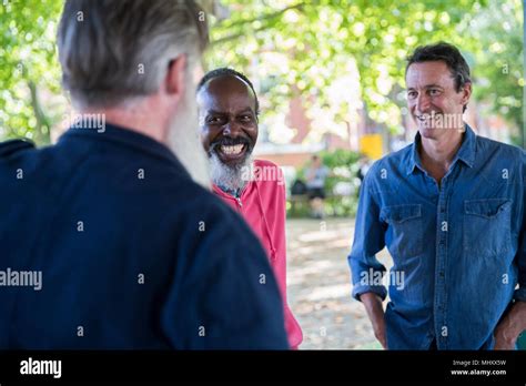 Three Mature Men Outdoors Talking Stock Photo Alamy