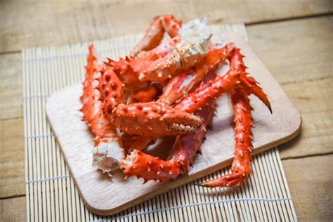 Premium Photo Alaskan King Crab Legs Cooked Seafood On Wooden Cutting