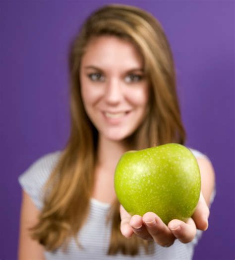 Free Picture Young Woman Extending Arm Holds Green Granny Smith Apple