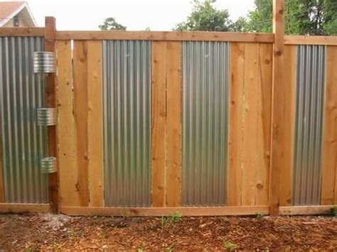 I've dreamt about building one of many fancy metal fences i've seen before we and the south side of the house with a plain corrugated gate. EnglishGardeners: wood and corrugated metal fence
