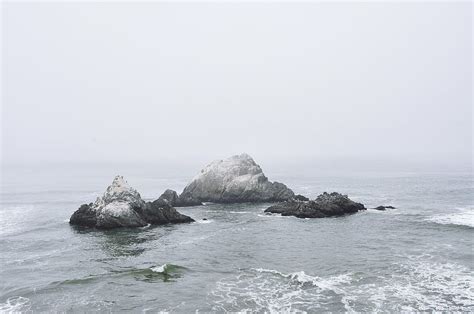Free Download Hd Wallpaper Rock Formations In Body Of Water Ocean