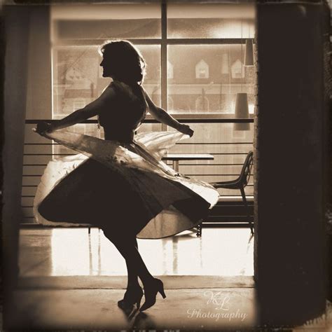 Sepia Cross Process Style Photo Of Woman In Sheer Dress Spinning Dancing Silhouette Vignette