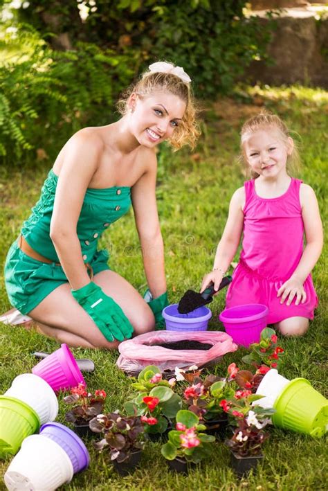 Mother And Daughter Planting Flowers Together Stock Image Image Of Happiness Happy 38616325