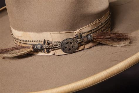 An Antique Horse Hair Hatband With Silver Mount On An Old Stetson