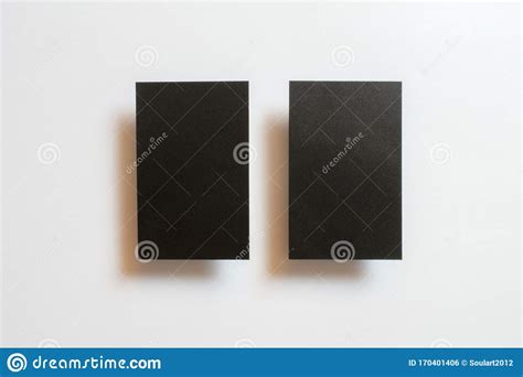 Two Black Blank Matt Textured Business Cards Flying And Isolated On