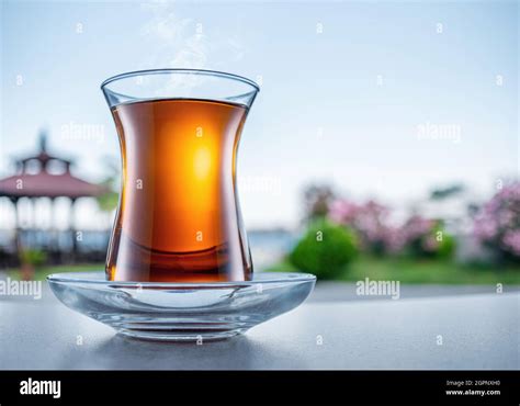 Turkish Tea Served In Tulip Shaped Glass On A Small Saucer Blurred