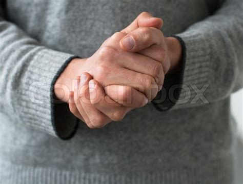 A Man Holds His Hands Folded Stock Image Colourbox