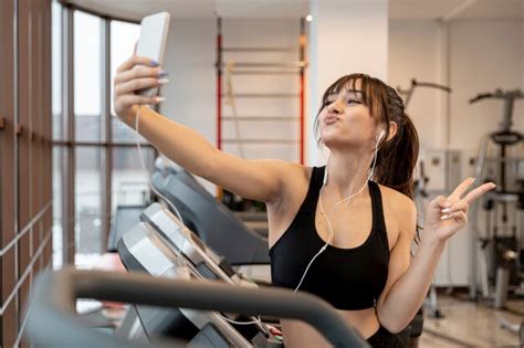Free Photo Playful Woman At Gym Taking Selfies