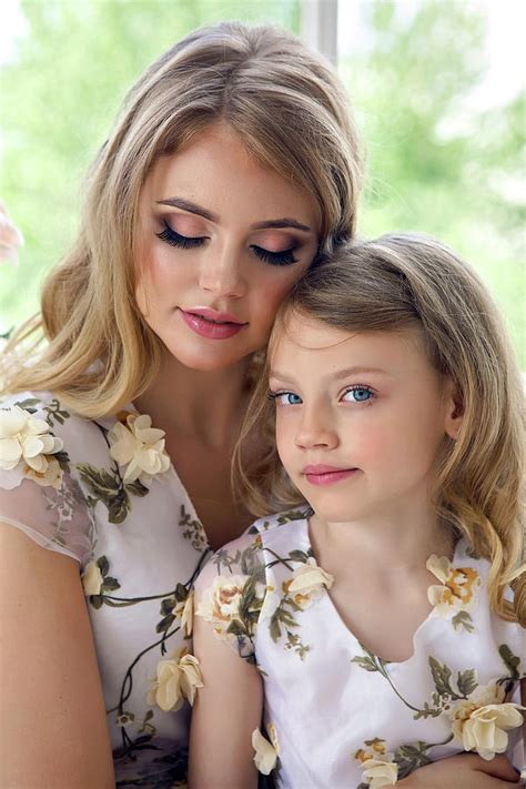mother kissing daughter in matching dresses 2 photograph by elena saulich pixels