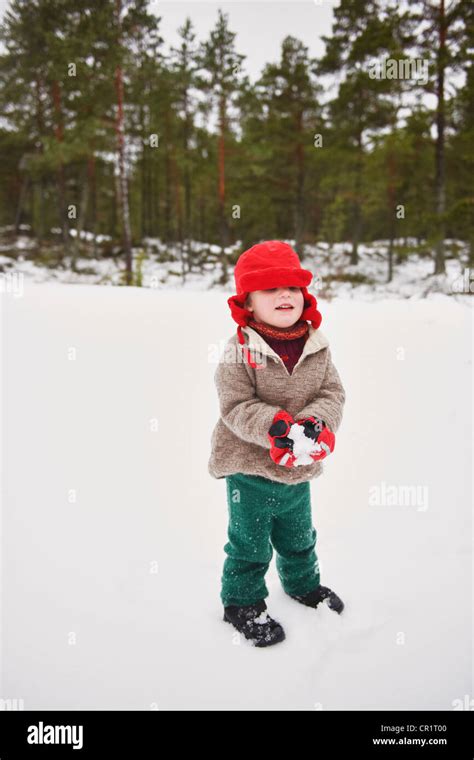 Boy Playing In Snow Outdoors Stock Photo Alamy