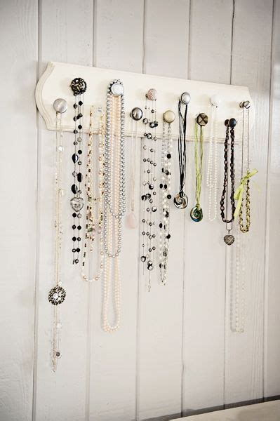I like to buy jewelry as souvenirs when i travel. How To Make a Fun Jewelry Display Hanger with Assorted Pieces of Cabinet Hardware | Diy jewelry ...