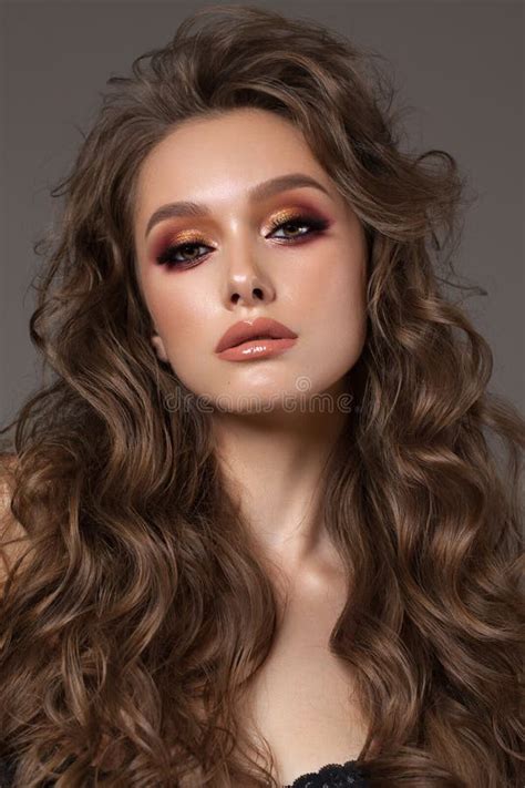 Young Brunette Model With Professional Makeup Perfect Skin Volume Hairstyle Colorful Smoky