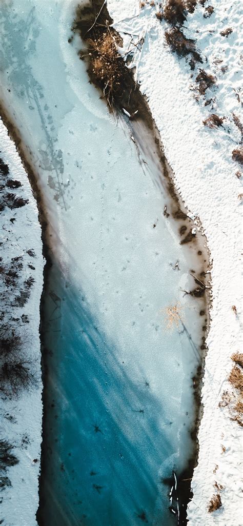 Aerial Photography Of River Beside Snow Field Iphone X Wallpapers Free
