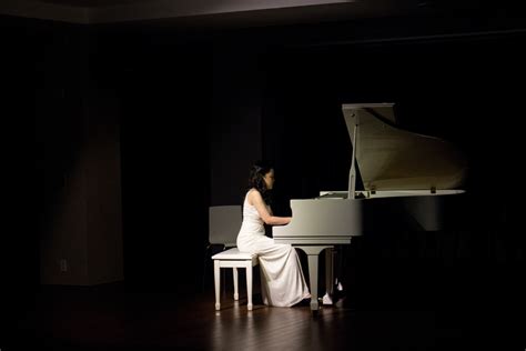 Woman Playing Grand Piano · Free Stock Photo