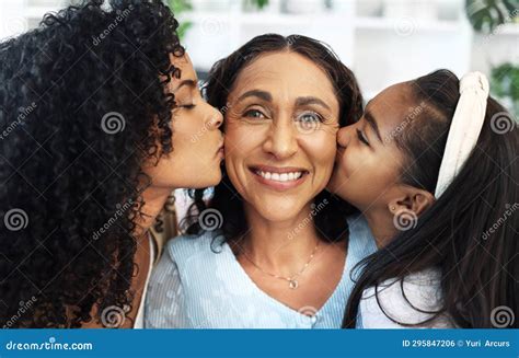 Portrait Kiss On The Cheek For A Senior Woman With Her Daughter And