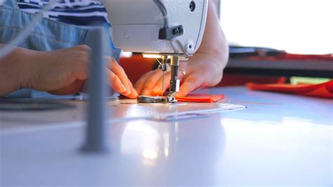 A Woman Makes Stitch Using Sewing Machine On Stock Footage Sbv