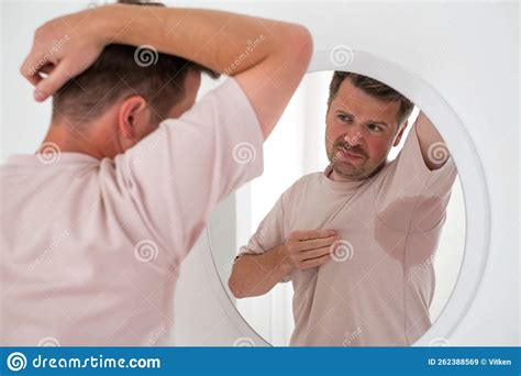 Man With Hyperhidrosis Sweating Very Badly Under Armpit Stock Image
