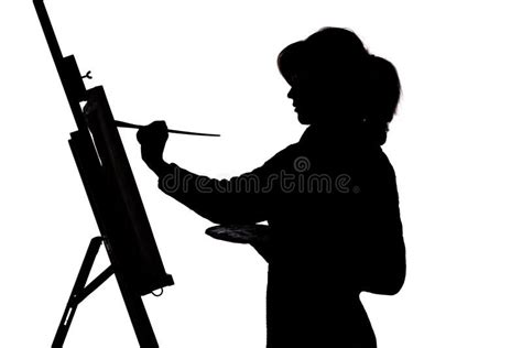 Silhouette Of A Young Woman Painting On An Easel On A White Isolated