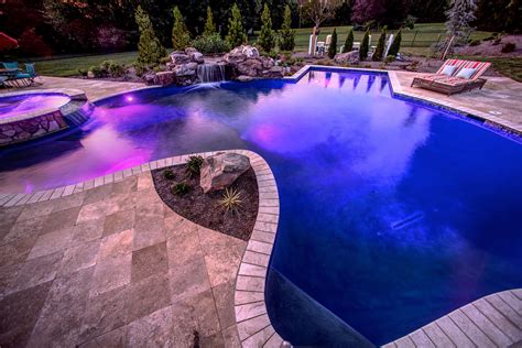 A small body of still water. Pool Lights Enhance Your Nighttime Swim | Woodfield Pools
