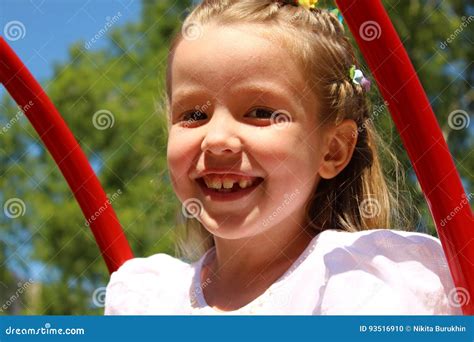 Portrait Of A Girl Swinging On A Swing Stock Photo Image Of Summer